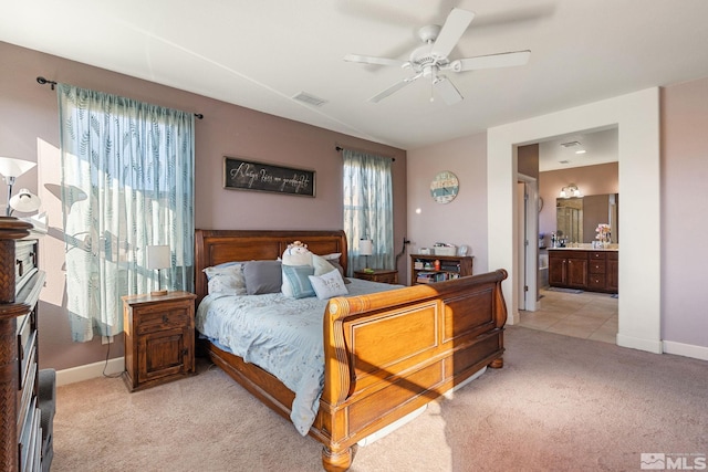 2780 Tobiano Dr, Reno, NV 89521 - bedroom featuring light carpet, baseboards, ensuite bathroom, and a ceiling fan