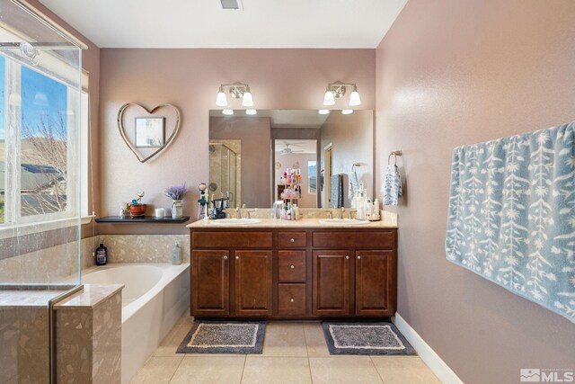 2780 Tobiano Dr, Reno, NV 89521 - bathroom featuring a shower stall, tile patterned floors, a garden tub, double vanity, and healthy amount of natural light