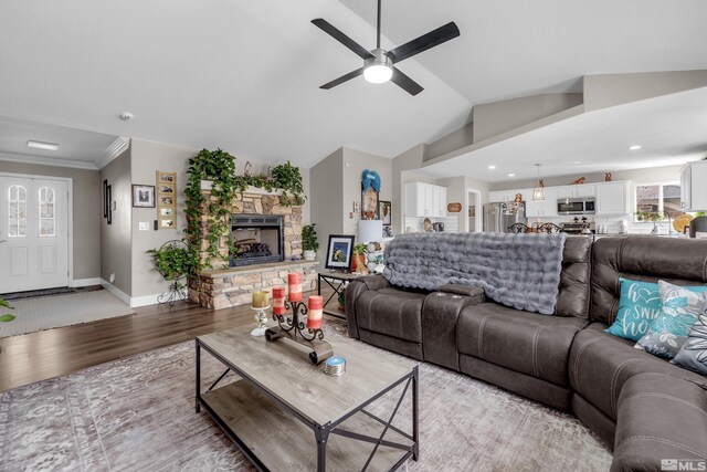 953 Julia Ln, Fernley, NV 89408 - living area featuring a ceiling fan, light wood-type flooring, a stone fireplace, recessed lighting, and baseboards