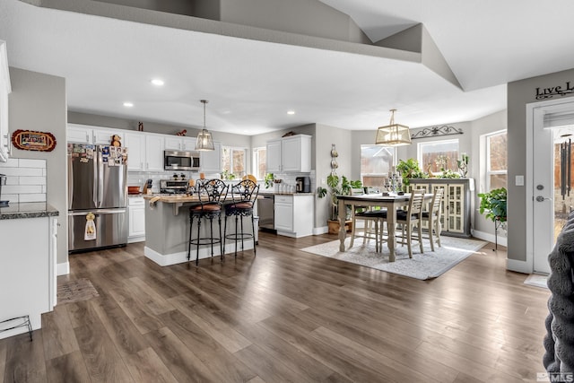 953 Julia Ln, Fernley, NV 89408 - dining space featuring healthy amount of natural light, recessed lighting, dark wood-style floors, and baseboards