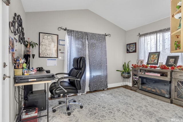 953 Julia Ln, Fernley, NV 89408 - home office featuring lofted ceiling, wood finished floors, and baseboards