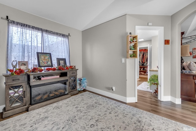 953 Julia Ln, Fernley, NV 89408 - entrance foyer with wood finished floors, vaulted ceiling, baseboards, and arched walkways