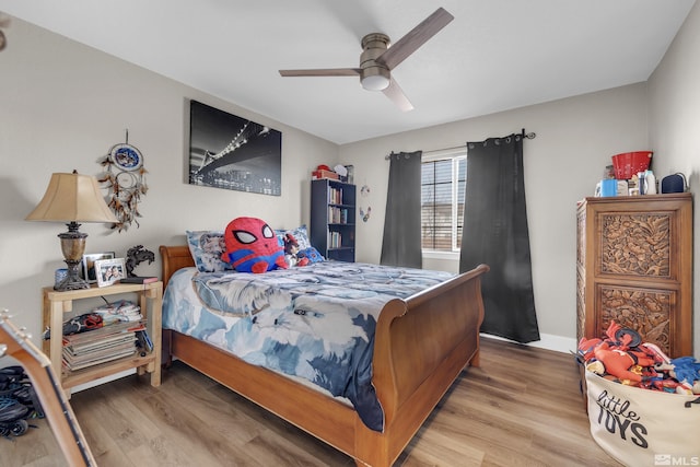 953 Julia Ln, Fernley, NV 89408 - bedroom with wood finished floors, a ceiling fan, and baseboards