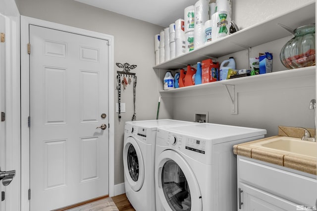 953 Julia Ln, Fernley, NV 89408 - clothes washing area with separate washer and dryer, light wood-type flooring, and cabinet space