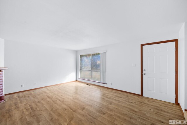 857 Cherry Tree Dr Unit 3, Sparks, NV 89434 - unfurnished living room with wood finished floors and baseboards