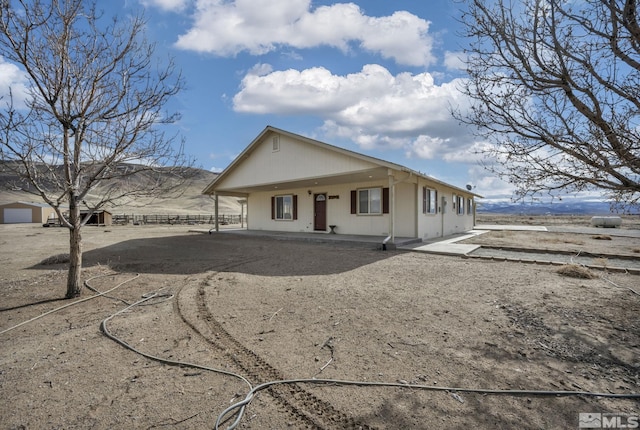 6100 Sage Flat Rd, Reno, NV 89510 - rear view of property with a porch