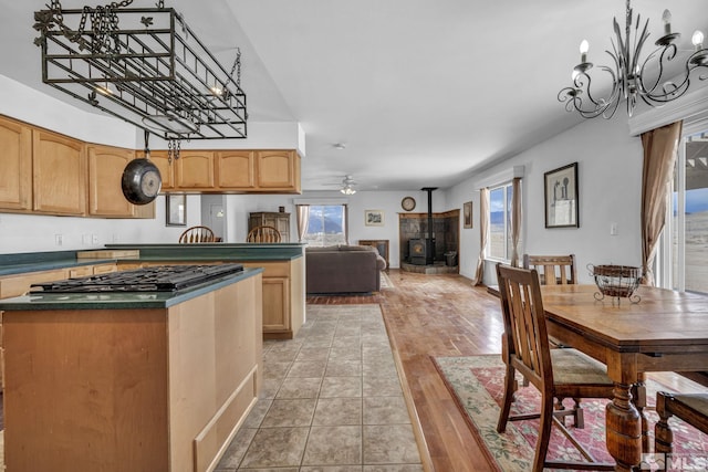 6100 Sage Flat Rd, Reno, NV 89510 - kitchen with gas stovetop, plenty of natural light, dark countertops, and a chandelier