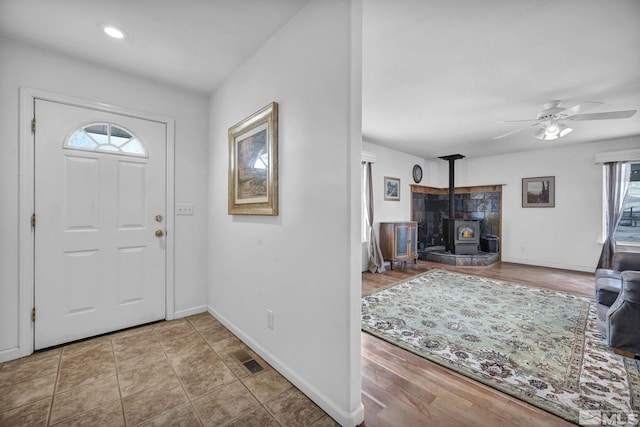 6100 Sage Flat Rd, Reno, NV 89510 - foyer featuring a wood stove, baseboards, and a ceiling fan