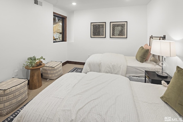 carpeted bedroom with baseboards and recessed lighting