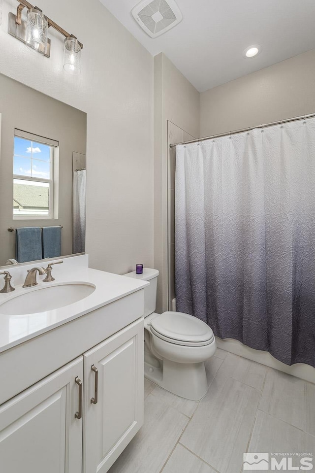 721 Marewood Trl, Reno, NV 89511 - bathroom with toilet, vanity, tile patterned floors, and curtained shower