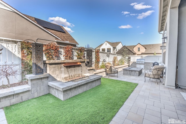 721 Marewood Trl, Reno, NV 89511 - view of yard with an outdoor stone fireplace, exterior kitchen, a patio, and a residential view