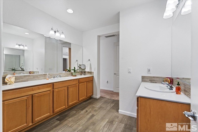 9820 Hafflinger Ln, Reno, NV 89521 - full bath featuring vanity, wood finished floors, and baseboards