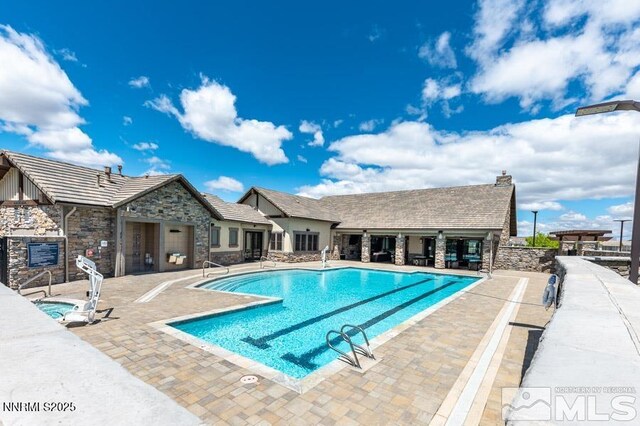 9820 Hafflinger Ln, Reno, NV 89521 - community pool with a patio area