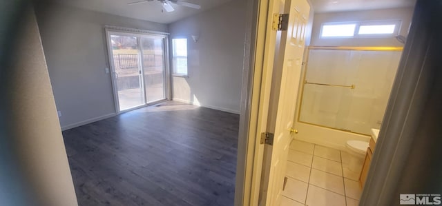 933 Julia Ln, Fernley, NV 89408 - full bath with ceiling fan, wood finished floors, toilet, and baseboards