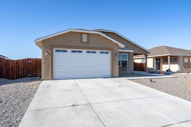 1953 Verona Dr, Fallon, NV 89406 - ranch-style house with stucco siding, fence, an attached garage, and driveway