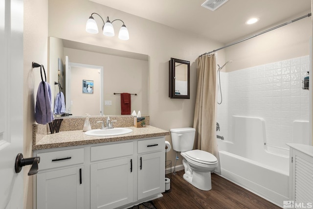 1953 Verona Dr, Fallon, NV 89406 - full bath featuring wood finished floors, vanity, toilet, and shower / bath combo with shower curtain