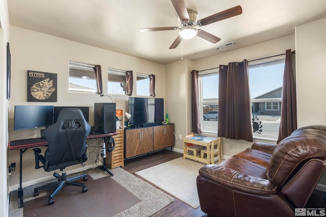 1953 Verona Dr, Fallon, NV 89406 - office area featuring dark wood-type flooring, ceiling fan, and baseboards