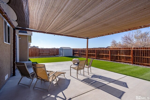 1953 Verona Dr, Fallon, NV 89406 - view of patio / terrace featuring a storage shed and an outbuilding