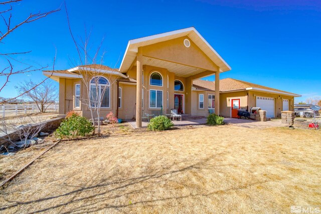 1253 Briggs Ln, Fallon, NV 89406 - back of property featuring a garage and stucco siding