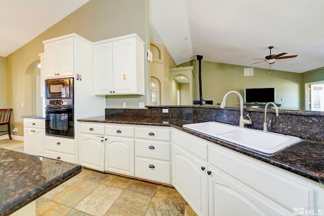 1253 Briggs Ln, Fallon, NV 89406 - kitchen featuring black appliances, vaulted ceiling, a sink, a ceiling fan, and dark stone countertops