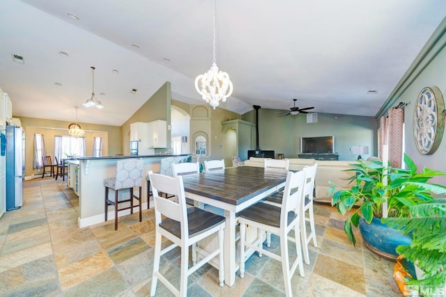 1253 Briggs Ln, Fallon, NV 89406 - dining space with a ceiling fan, a chandelier, lofted ceiling, and arched walkways