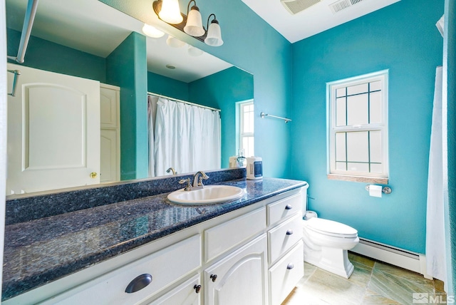 1253 Briggs Ln, Fallon, NV 89406 - bathroom with baseboard heating, vanity, toilet, and baseboards