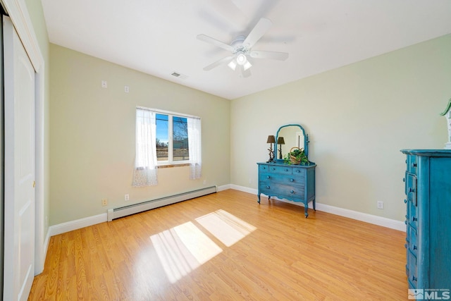 1253 Briggs Ln, Fallon, NV 89406 - bedroom featuring a baseboard radiator, light wood finished floors, and baseboards