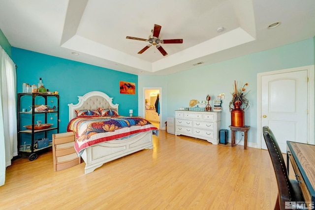 1253 Briggs Ln, Fallon, NV 89406 - bedroom featuring a raised ceiling, wood finished floors, a ceiling fan, and baseboards
