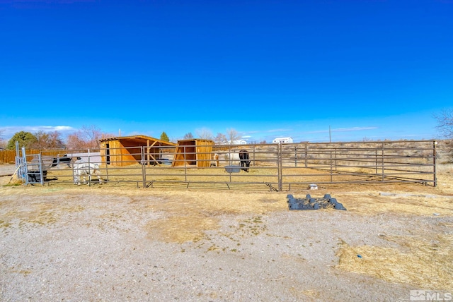 1253 Briggs Ln, Fallon, NV 89406 - view of yard featuring an exterior structure, an outbuilding, and a view of countryside