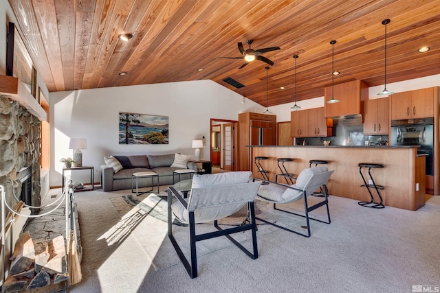572 Rockrose Ct, Incline Village, NV 89451 - living area featuring wooden ceiling, light colored carpet, vaulted ceiling, ceiling fan, and a stone fireplace