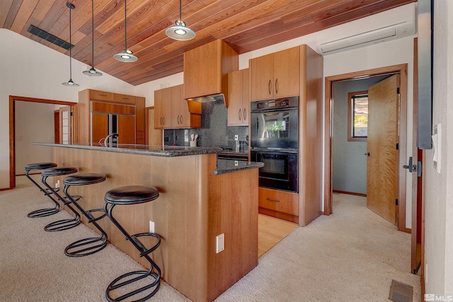 572 Rockrose Ct, Incline Village, NV 89451 - kitchen with light carpet, a wall unit AC, a breakfast bar area, wood ceiling, and tasteful backsplash