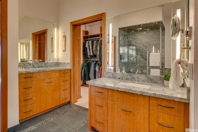 572 Rockrose Ct, Incline Village, NV 89451 - full bathroom with a shower stall, two vanities, inlaid floor details, and tile patterned floors