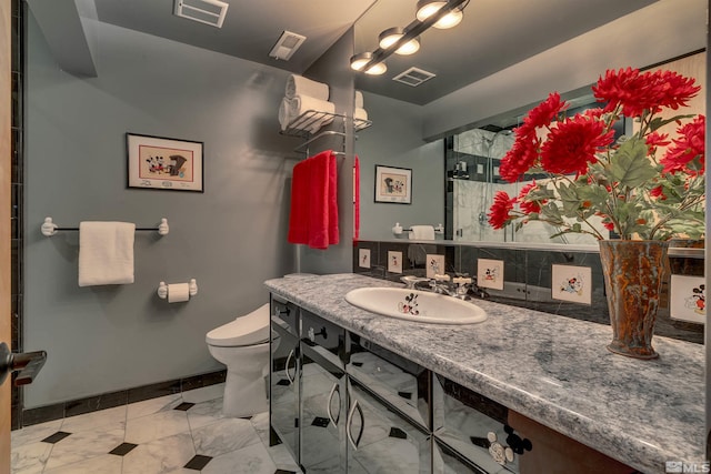 572 Rockrose Ct, Incline Village, NV 89451 - bathroom featuring vanity, toilet, tile patterned flooring, baseboards, and a shower