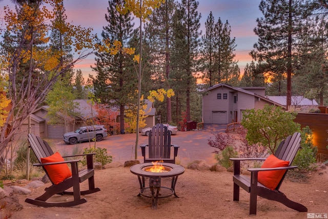 572 Rockrose Ct, Incline Village, NV 89451 - view of yard featuring an outdoor fire pit and a garage
