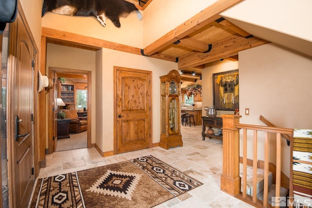 1101 Sierra Country Ct, Gardnerville, NV 89460 - entrance foyer with stone tile flooring and beam ceiling