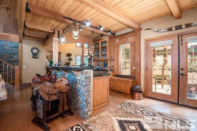 1101 Sierra Country Ct, Gardnerville, NV 89460 - bar with french doors, light wood finished floors, plenty of natural light, wooden ceiling, and stairway