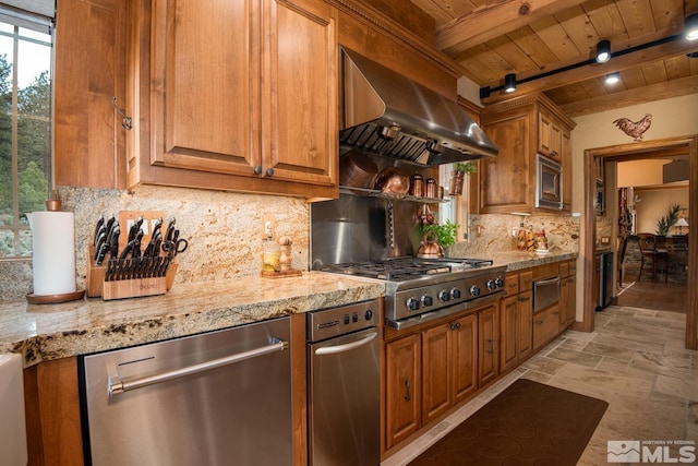 1101 Sierra Country Ct, Gardnerville, NV 89460 - kitchen with stainless steel appliances, wall chimney exhaust hood, wooden ceiling, plenty of natural light, and stone tile floors