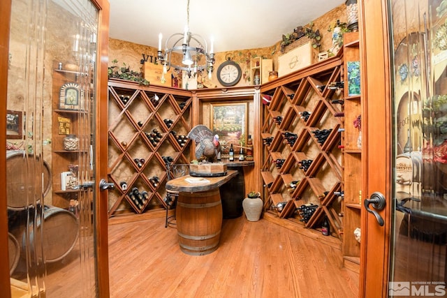 1101 Sierra Country Ct, Gardnerville, NV 89460 - wine area with wood finished floors and a chandelier