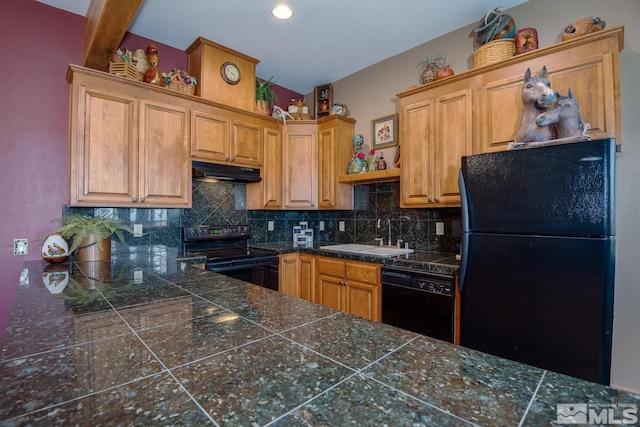 1101 Sierra Country Ct, Gardnerville, NV 89460 - kitchen with black appliances, under cabinet range hood, a sink, tile countertops, and backsplash