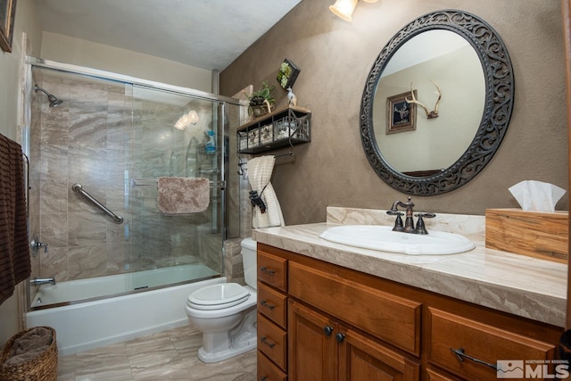 1101 Sierra Country Ct, Gardnerville, NV 89460 - bathroom with combined bath / shower with glass door, toilet, vanity, and a textured wall