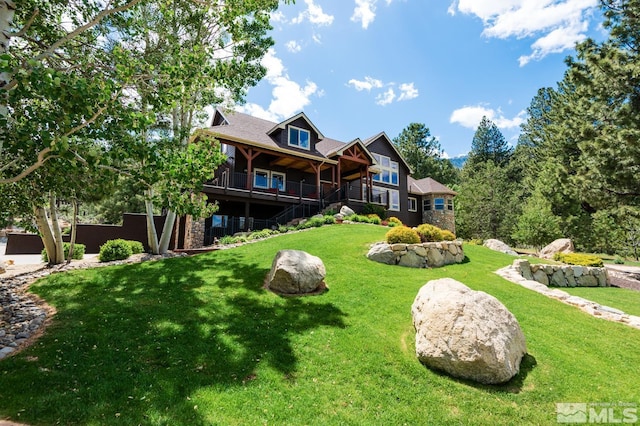 1101 Sierra Country Ct, Gardnerville, NV 89460 - view of front of house with a front yard, stairs, and a deck