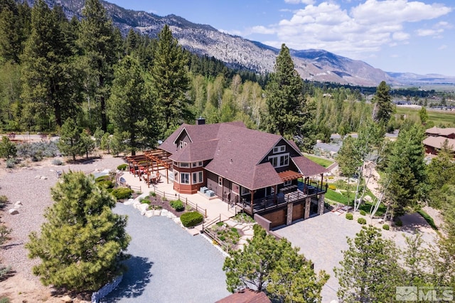1101 Sierra Country Ct, Gardnerville, NV 89460 - aerial view of property and surrounding area featuring a mountainous background and a forest