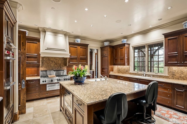 6025 Lake Geneva, Reno, NV 89511 - kitchen with a kitchen island with sink, appliances with stainless steel finishes, premium range hood, tasteful backsplash, and a sink