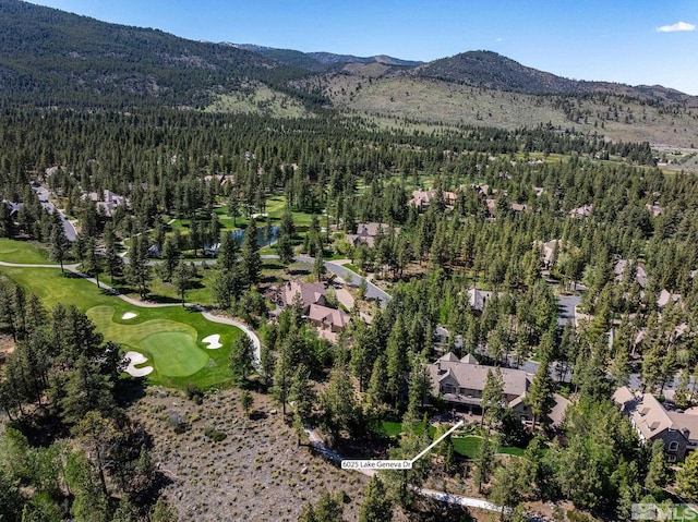 6025 Lake Geneva, Reno, NV 89511 - aerial view of property and surrounding area featuring a forest, a mountainous background, and a local golf course