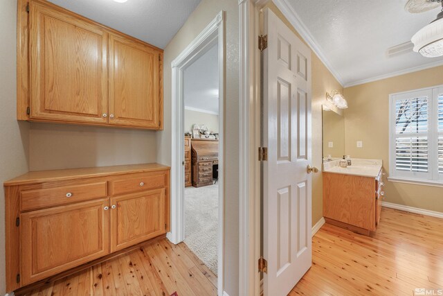 1973 Arabian Ln, Gardnerville, NV 89410 - hallway with crown molding, light wood finished floors, and baseboards