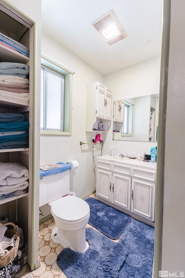 134 E 6th St, Battle Mountain, NV 89820 - bathroom with plenty of natural light, vanity, and toilet