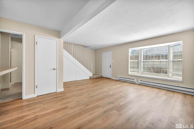 435 Pine Meadows Dr # 33, Sparks, NV 89431 - unfurnished living room with stairs, light wood finished floors, and baseboards