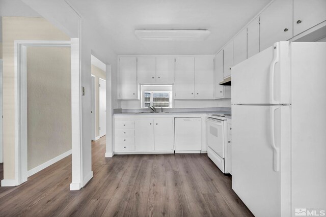 435 Pine Meadows Dr # 33, Sparks, NV 89431 - kitchen featuring white appliances, dark wood-type flooring, white cabinets, and baseboards
