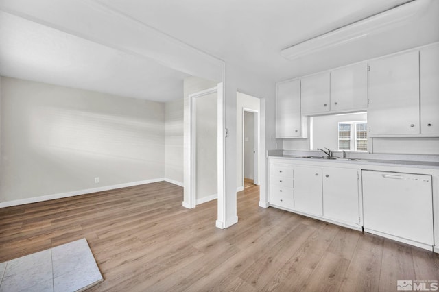 435 Pine Meadows Dr # 33, Sparks, NV 89431 - kitchen featuring light countertops, light wood-style flooring, dishwasher, and baseboards
