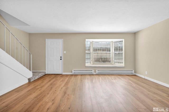 435 Pine Meadows Dr # 33, Sparks, NV 89431 - entryway featuring a baseboard heating unit, wood finished floors, baseboards, and stairs